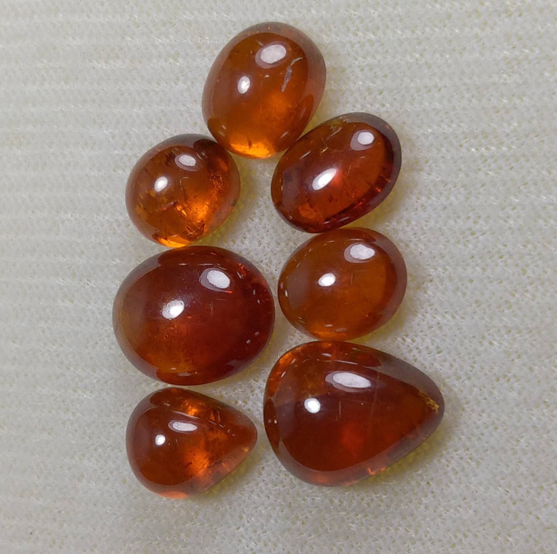 ARSAA GEMS AND MINERALSNatural top quality beautiful 31 carats small lot of spessartine garnet Cabochons - Premium  from ARSAA GEMS AND MINERALS - Just $60.00! Shop now at ARSAA GEMS AND MINERALS